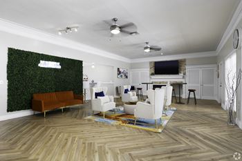 a living room with white furniture and a green wall